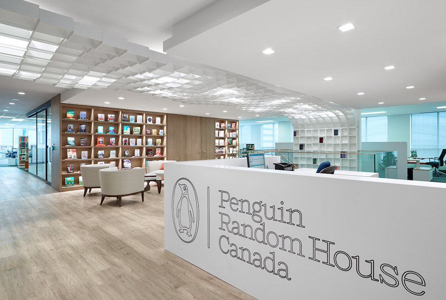 Penguin Random House reception area with white desk with logo and bookshelves in background